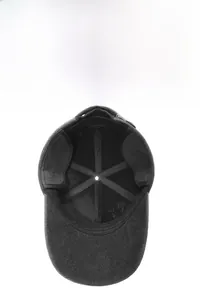 Detail view of the warm earflaps and reinforced lining inside the dark gray wool baseball cap