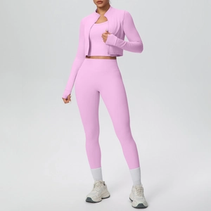 Three-piece light pink yoga set featuring a zipper jacket with thumb holes and high-waist pants