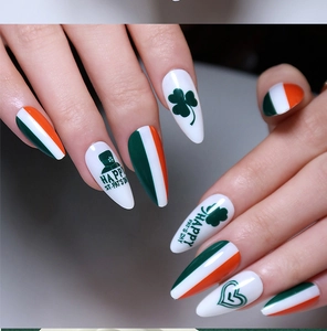 Detail of St. Patrick's Day stiletto press-on nails with clover and flag patterns