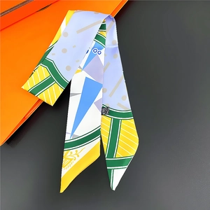 Polychromatic geometric print twilly silk scarf for women displayed on a gift box