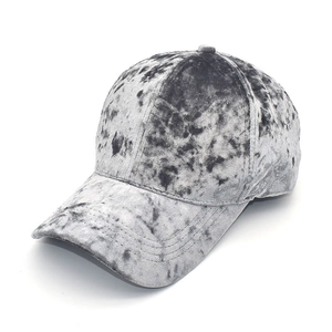 Detailed view of gray velvet baseball cap with marble texture and premium stitching