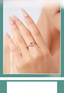 Detail of pink rectangular cut gemstone ring with a minimalist silver finish band