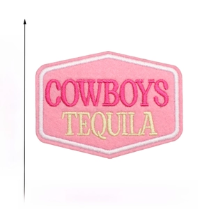 Detailed view of pink embroidered patch showing 6cm x 8.3cm dimensions and tequila text