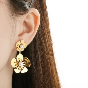 Exaggerated 18K gold plated stainless steel coral pearl flower earrings on model