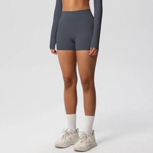 Detail view of high waisted dark grey blue athletic shorts with seamless tummy control design