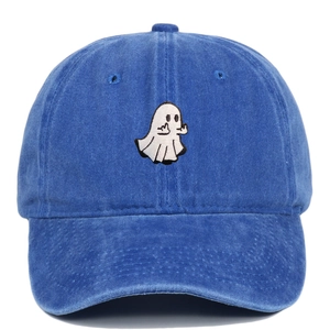 Detail shot of white ghost embroidery showing middle finger on washed navy baseball cap