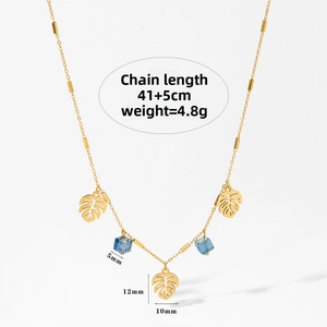 Close-up of golden necklace with hollow leaves and blue cubic beads, 41+5cm chain length