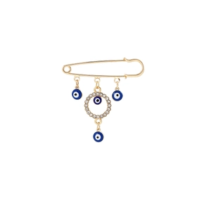 Detail of gold tassel brooch with blue evil eye pendant and sparkling crystals