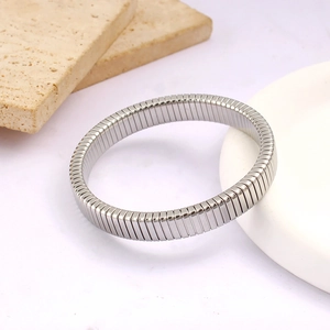 Detailed close-up of a silver elastic stretch bracelet with minimalist industrial design
