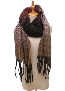 Detail of multi-color knitted scarf with gradient fringe and rich woven texture