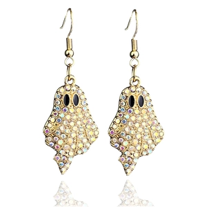 Macro view of gold ghost earrings with sparkling colorful rhinestones and black gem eyes
