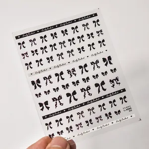 Detail of ultra-thin black bowknot nail stickers item 4595 on a white background