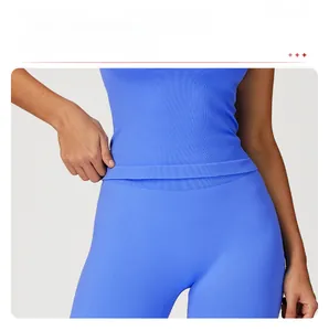 Detail of blue high-elastic ribbed yoga top with longline hem and tummy control fit