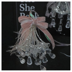 Close-up of pink velvet bow crystal ornament with transparent beads on dark background