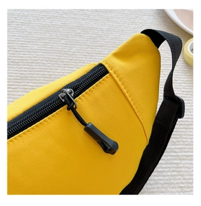 Detail of high-density yellow canvas fabric and sturdy black nylon zipper for kids chest bag