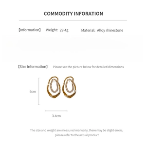 Detailed view of gold-plated oval rhinestone earrings with 6cm x 3.4cm dimensions