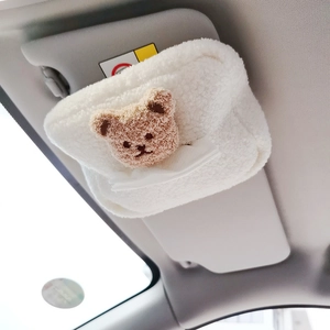 Plush teddy bear car tissue holder in white fleece installed on sun visor for easy access