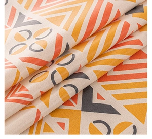 Close-up of bohemian linen tablecloth fabric showing geometric patterns and woven texture