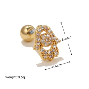 Detailed close-up of 18k gold plated Hamsa hand earring with sparkling zircon stones