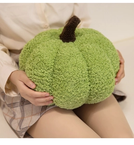 Close-up of a grass green pumpkin plush pillow in soft sherpa fleece fabric