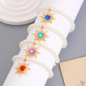 Vintage pearl bracelets with sun pendants and multicolored gemstone centers for women