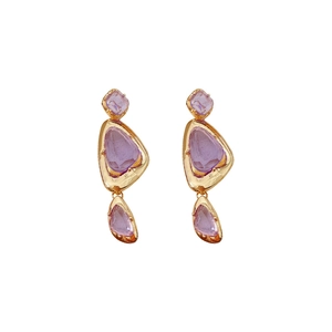 Vintage irregular gold earrings with purple gemstone pendants on a white background