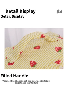 Detail display of the wide padded handle on the strawberry quilted makeup bag