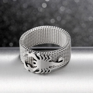 Detailed close-up of a silver mesh band ring with a 3D scorpion punk design