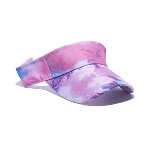 Detailed view of a colorful pink and blue tie-dye sports sun visor hat with long sunshade brim