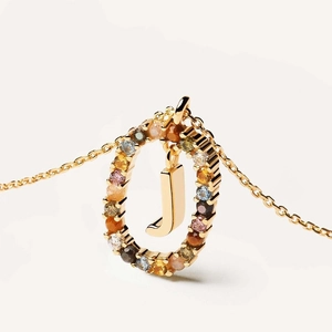 Gold letter J pendant necklace featuring colorful crystals and oval gemstone halo