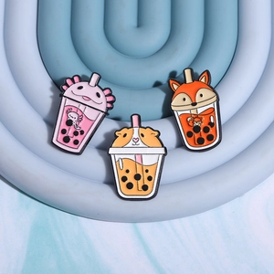 Three cute animal bubble tea enamel pins featuring axolotl, corgi, and fox designs