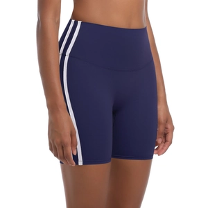 Detail of high-waisted navy blue yoga shorts with white side stripes and quick-dry texture