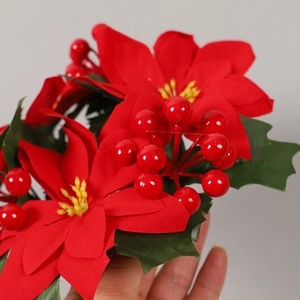 Artificial Christmas poinsettia wreath with red berries and green leaves for table decor