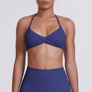 Detail of blue-purple halter neck sports bra with ruched front and high-stretch fabric