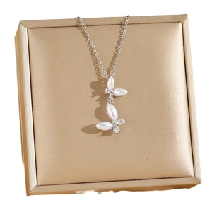 Titanium steel necklace featuring double butterfly pearl pendant in golden gift box