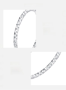 Detail view of 925 sterling silver ring with faceted diamond-cut texture and polished finish