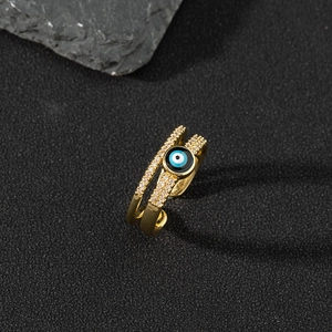 Macro shot of double-layer evil eye ring with 18K gold plating and micro-pave crystals