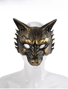 Detailed view of wolf mask with metallic bronze finish and intricate carved textures