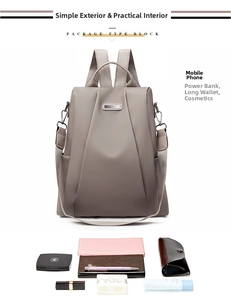 Detail of grey Oxford backpack showing spacious interior for phone, wallet and cosmetics