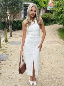 White sleeveless shirt dress with button-down front and lapel collar for summer wear