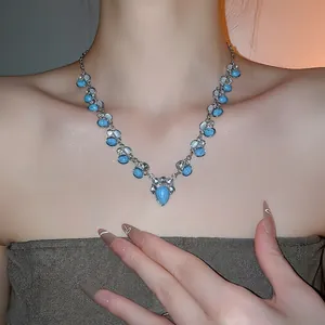 Vintage bohemian necklace with teardrop turquoise stone and silver metal accents for women
