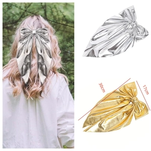 Metallic bow hair clip details showing gold and silver finishes with 30cm large dimensions