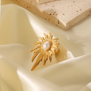 Vintage golden leaf pattern open ring with white pearl on elegant satin background