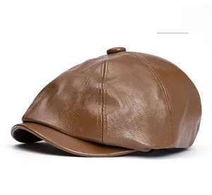 Detailed close-up showing texture and stitching of a khaki PU leather newsboy cap