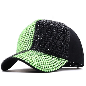 Black and fluorescent green rhinestone baseball cap with sparkling crystal embellishments