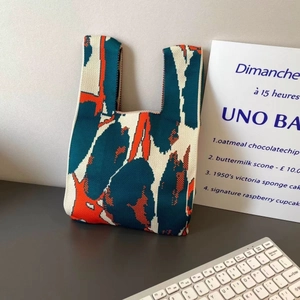Knitted tote bag with blue and orange abstract artistic pattern for casual style