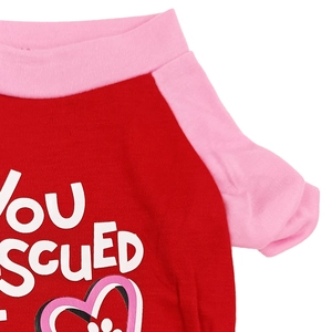 Detail of red and pink pet vest featuring a You Rescued print and high-quality stitching
