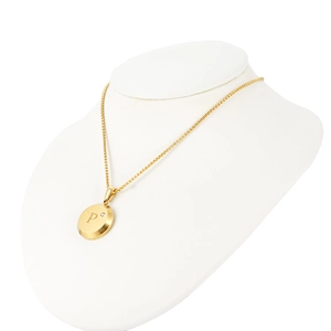 Detailed macro view of 18K gold plated pendant with letter P and cubic zirconia stone