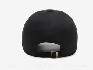 Detail view of the black baseball cap back with a vintage bronze metal adjustment buckle