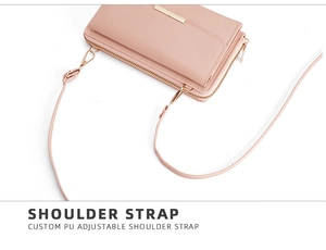 Detail view of pink PU leather purse with adjustable shoulder strap and gold metal bar